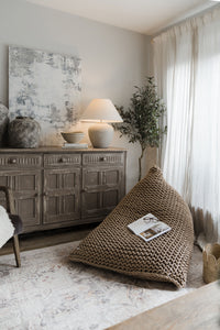 beige beanbag chair in neutral cottage home interiors