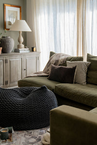 beanbag in cosy living room space with neutral and olive tones