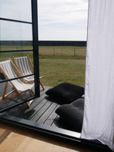 Load image into Gallery viewer, black and grey large floor cushions outside on garden decking
